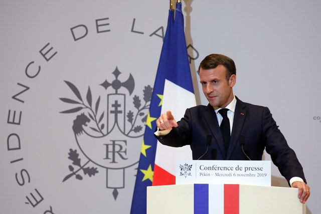 French President Emmanuel Macron holds a press conference at the French embassy at the end of his three days official visit in China, in Beijing, on Wednesday (AFP photo)