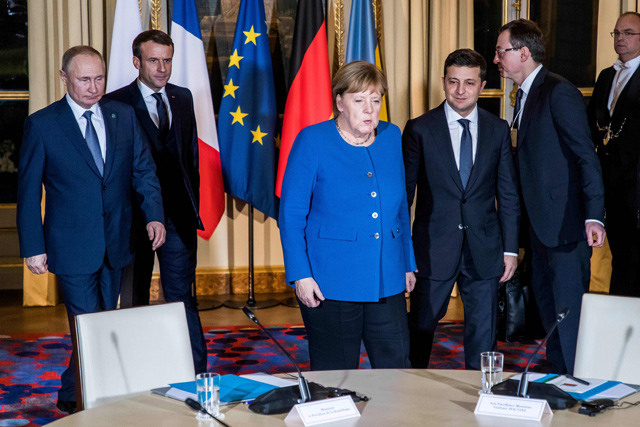From left to right: Russian President Vladimir Putin, French President Emmanuel Macron, German Chancellor Angela Merkel and Ukrainian President Volodymyr Zelensky, arrive for a meeting on Ukraine at the Elysee Palace, in Paris, on Monday  (AFP photo)