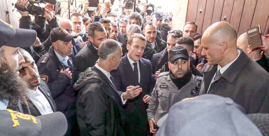 French President Emmanuel Macron asks Israeli forces to leave the 12th-century Church of Saint Anne in the old city of Jerusalem on Wednesday (AFP photo)