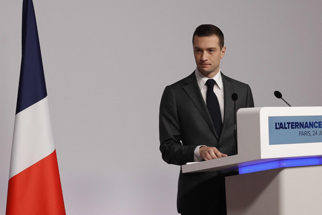 French far-right Rassemblement National (RN) Party President Jordan Bardella delivers a speech to present the priorities of the ‘national unity government’ in case the score of the party in the snap parliamentary vote gives it a shot at naming a prime minister, in Paris on Monday (AFP photo)