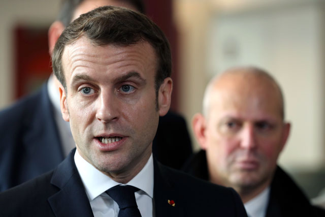 France’s President Emmanuel Macron speaks to journalists during a visit to an EHPAD (Housing Establishment for Dependant Elderly People) in the 13th arrondissement of Paris on Friday (AFP photo)