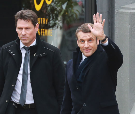 French President Emmanuel Macron waves to members of the public on Sunday, as he leaves Le Touquet, northern France, after voting in the first round of France's mayoral elections (AFP photo)