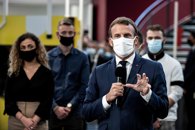French President Emmanuel Macron delivers a speech as he visits the Hall 32 in Clermont-Ferrand, on Tuesday  (AFP photo)