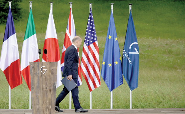 Germany's Chancellor Olaf Scholz leaves after giving a statement on Tuesday at Elmau Castle, southern Germany, at the end of the G-7 summit (AFP photo)
