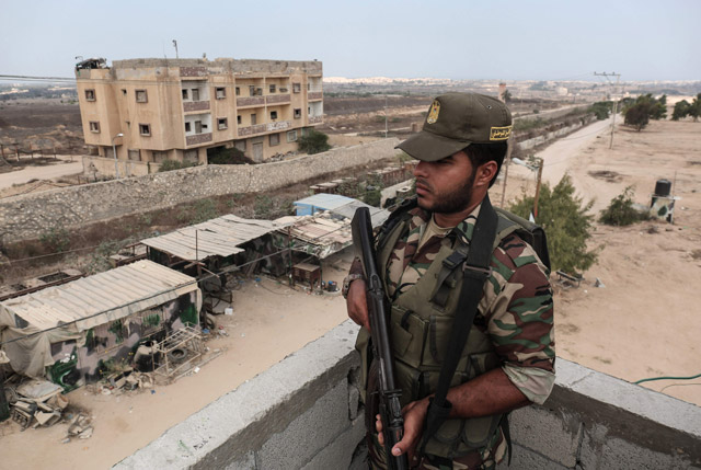 A member of Palestinian security forces loyal to Hamas patrols the southern Gaza Strip town of Rafah near the border with Egypt on Thursday (AFP photo)