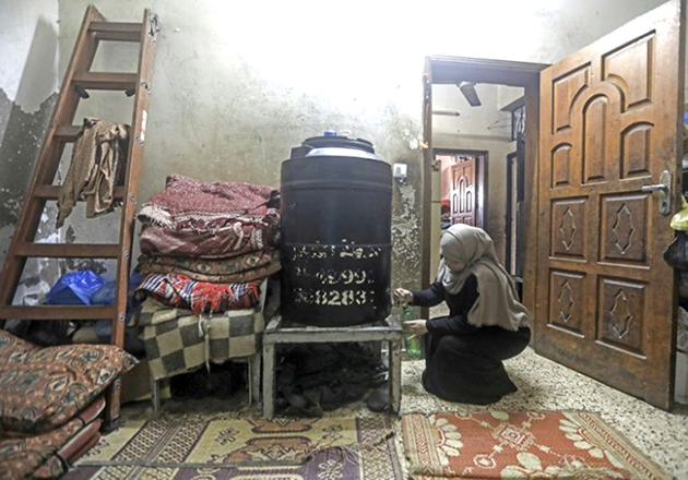 Jibril and his wife live with their six children in a cramped two-bedroom flat on the outskirts of Gaza City (AFP photo)