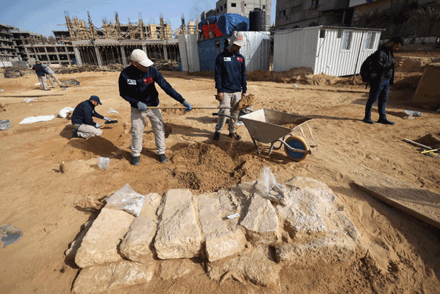 Palestinian workers excavate a recently-discovered Roman cemetery containing ornately decorated graves in Beit Lahia in the northern Gaza Strip, on Monday (AFP photo)