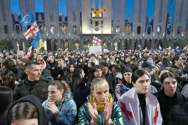 Protesters take part in a demonstration called by Georgian opposition and civil society groups outside Georgia's parliament in Tbilisi on Wednesday (AFP photo)
