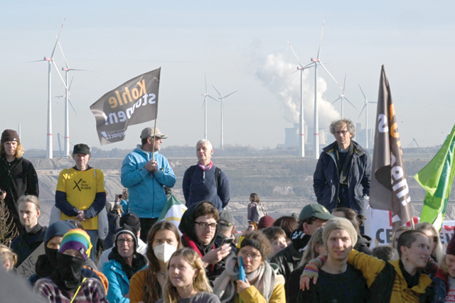 Activists take part in a demonstration against coal mining at the Garzweiler lignite open cast mine near Luetzerath, western Germany, on Saturday (AFP photo)