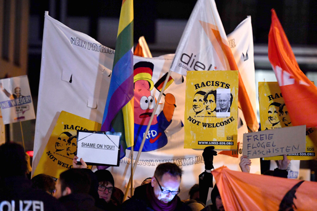 Protesters hold a rally outside the headquaters of the Free Democratic Party in Berlin, on Wednesday (AFP photo)