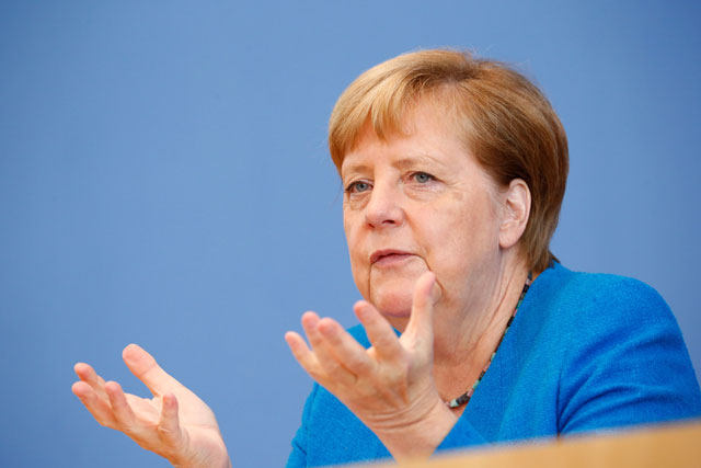 German Chancellor Angela Merkel speaks during her annual summer press conference on Friday in Berlin (AFP photo)