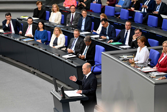 German Chancellor Olaf Scholz addresses delegates at the Bundestag (lower house of parliament) in Berlin on Wednesday (AFP photo)