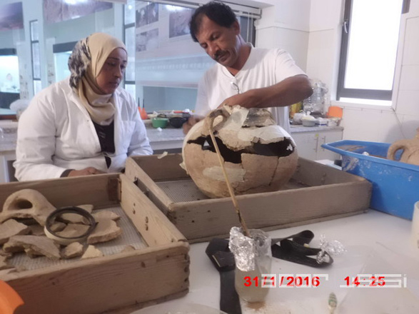 Members of the local community restore pottery discovered in the area south of the Dead Sea at the laboratory of the Museum on the Lowest Place on Earth in Ghor Safi (Photo courtesy of ACOR)