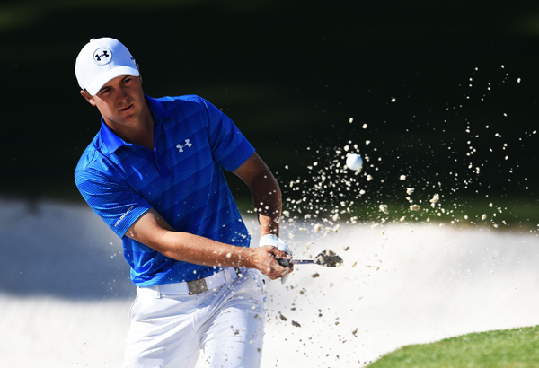 This file photo taken on April 10, 2016 shows US golfer Jordan Spieth hitting out of a bunker on the 10th green during Round 4 of the 80th Masters Golf Tournament at the Augusta National Golf Club in Augusta, Georgia (AFP photo Jim Watson)