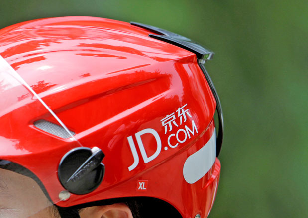 A logo of JD.com is seen on a helmet of a delivery man in Beijing, China, on June 16, 2014 (Reuters file photo)