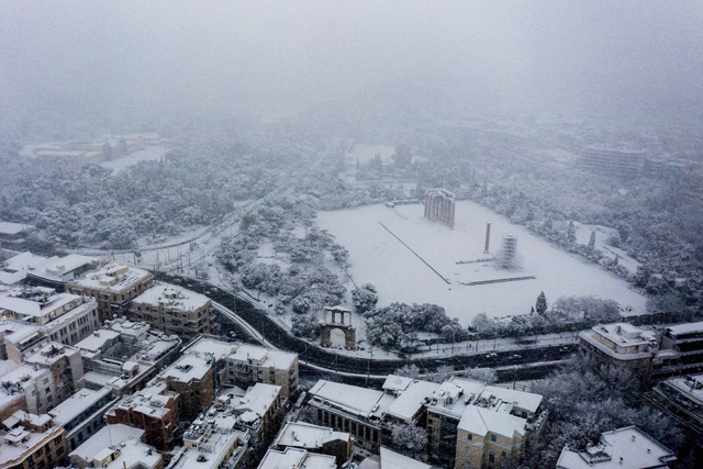 In this aerial photograph the ancient temple of Zeus is covered by snow during a rare heavy snowfall in the city of Athens on Tuesday (AFP photo)