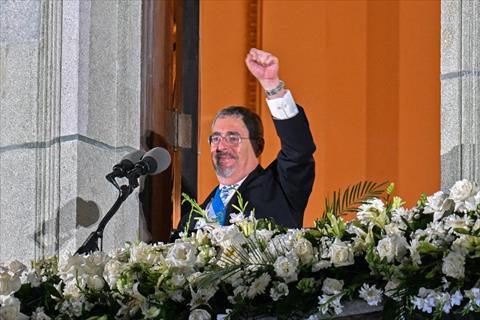 Guatemala’s new President Bernardo Arevalo gestures at supporters from a balcony of the Miguel Angel Asturias Cultural Centre in Guatemala City, after the inauguration ceremony, early on Monday (AFP photo)