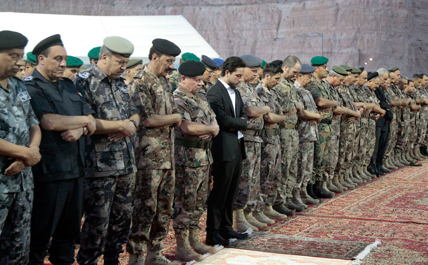 His Majesty King Abdullah, the Supreme Commander of the Jordan Armed Forces-Arab Army, HRH Crown Prince Hussein and Royal family members are joined by top brass in performing Maghreb prayers on Wednesday at the army headquarters (Photo courtesy of Royal Court)