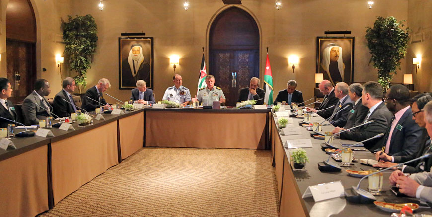 His Majesty King Abdullah meets with delegates from UK-based Royal College of Defence Studies in Amman on Sunday (Photo courtesy of Royal Court)