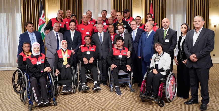 His Majesty King Abdullah meets with members of the Hashemite Commission for Soldiers with Disabilities team, which participated in the 2018 Invictus Games, on Thursday (Photo courtesy of Royal Court)
