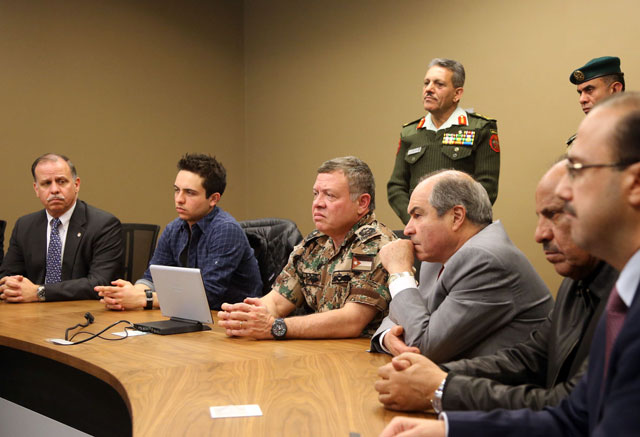 His Majesty King Abdullah oversees a security operation targeting suspected terrorists holed up in a Karak village from a crisis management centre in Amman on Tuesday  (Photo courtesy of Royal Court)