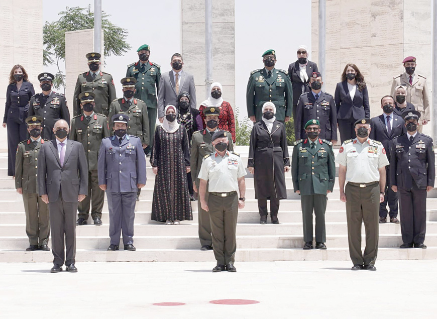 His Majesty King Abdullah, the Supreme Commander of the Jordan Armed Forces-Arab Army , poses for a group photo during a graduation ceremony at   the Royal Jordanian National Defence College on Monday  (Photo courtesy of Royal Court)