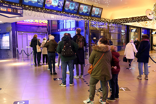Patrons queue for tickets to enter the Cinema UGC at the Galerie de la Toison d'Or in Brussels on Thursday (AFP photo)