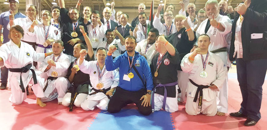Jordanian karate coach Hussam Ayyad (centre) joins winners of an international competition in a group photo held in the US recently (Photo courtesy of Hussam Ayyad)
