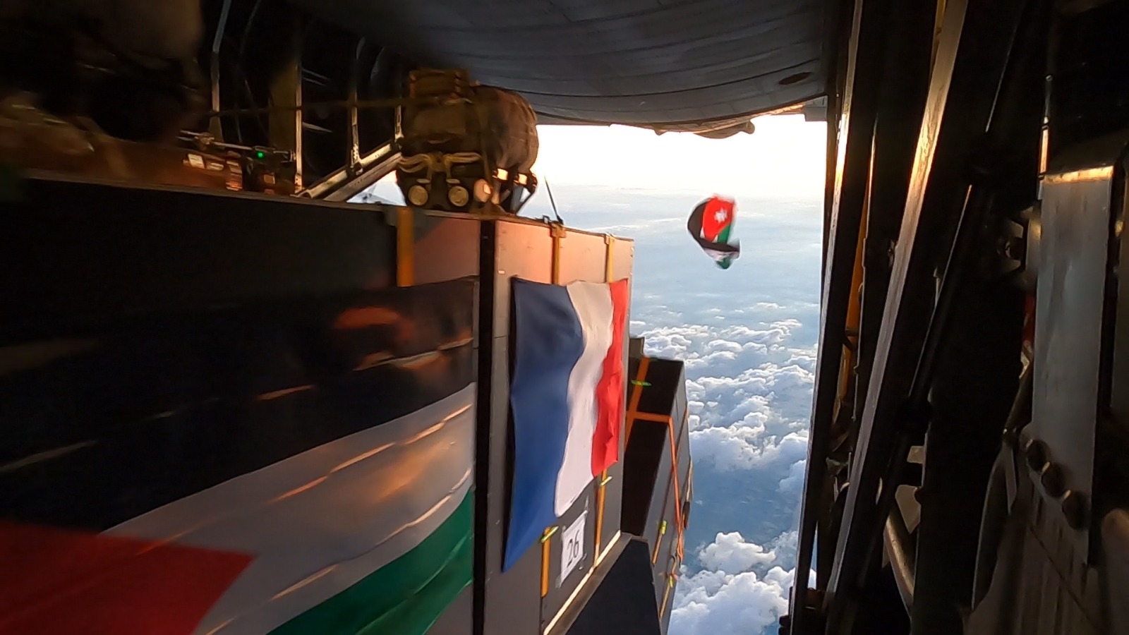 C-130 aircraft from the Royal Jordanian Air Force and the French Air Force conducts two airdrops in the vicinity of the Jordanian Private Field Hospital/ 2 in Khan Younis , Gaza, on Friday (Petra photo)