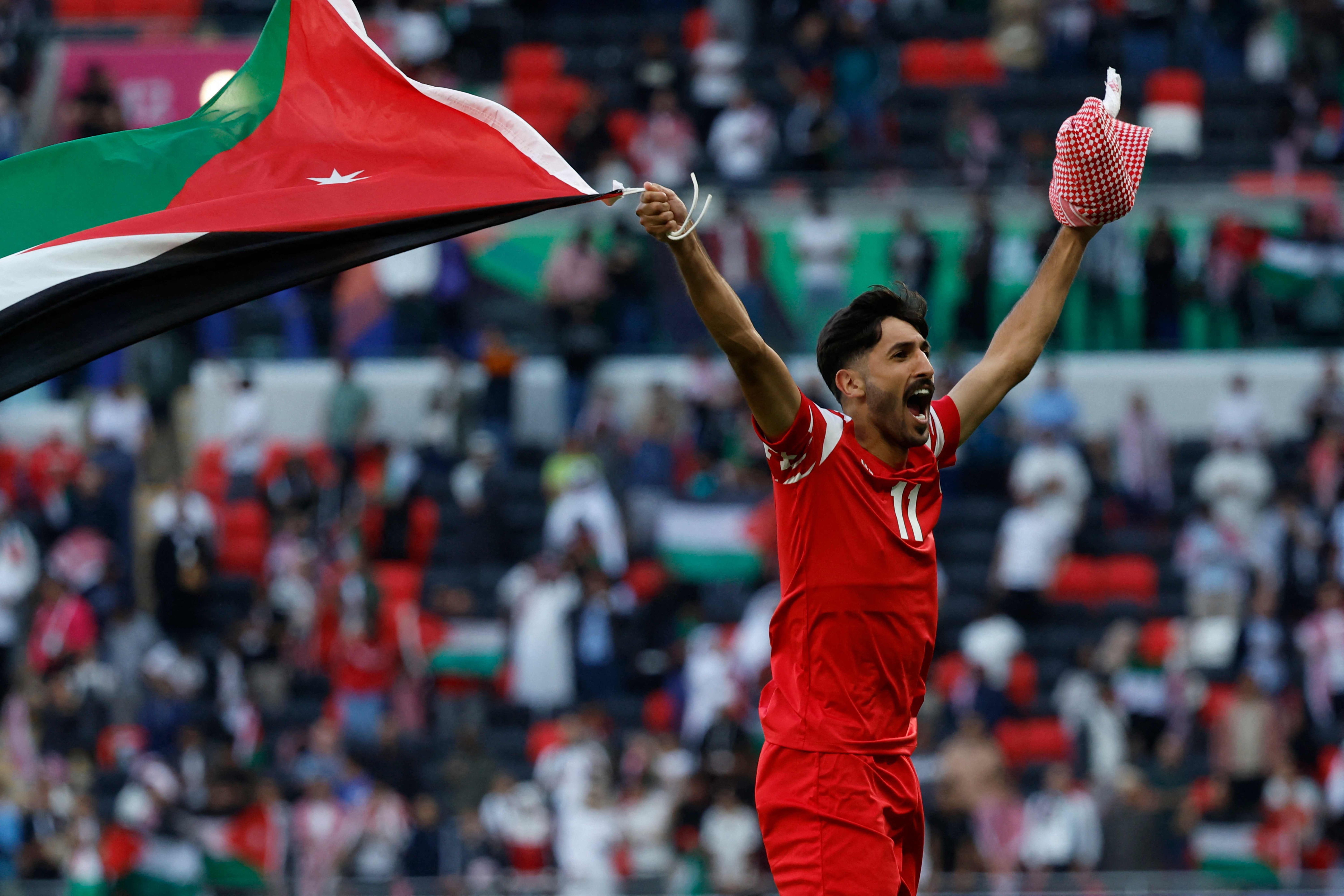 Jordan's forward #11 Yazan Al Naimat celebrates his team's victory during the Qatar 2023 AFC Asian Cup quarter-final football match between Tajikistan and Jordan at the Ahmad Bin Ali Stadium in Al Rayyan, west of Doha on Friday (AFP photo)