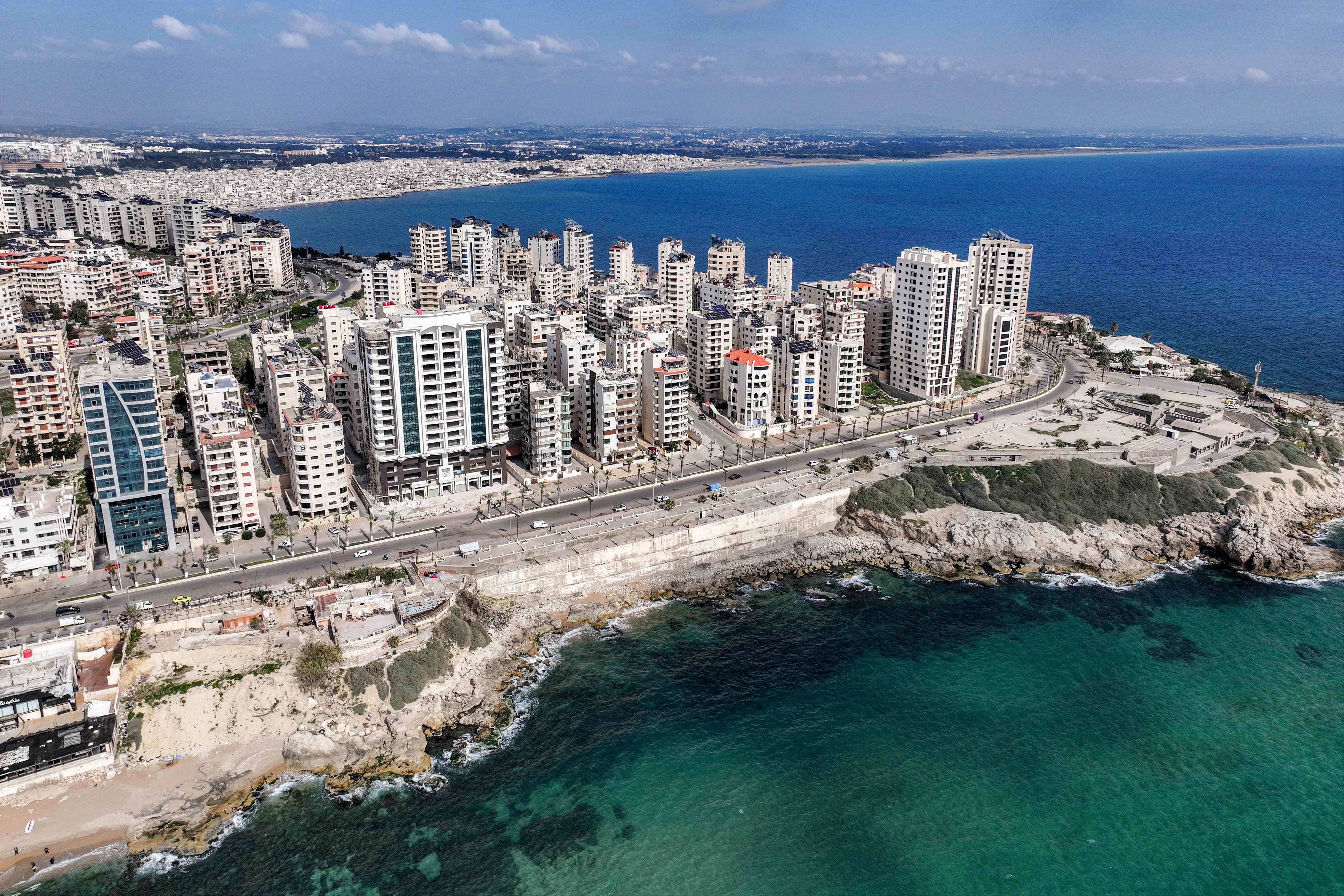 This aerial view shows buildings along the cape on the southern corniche near the seaport of Syria's western city of Latakia on March 9, 2025 (AFP photo)