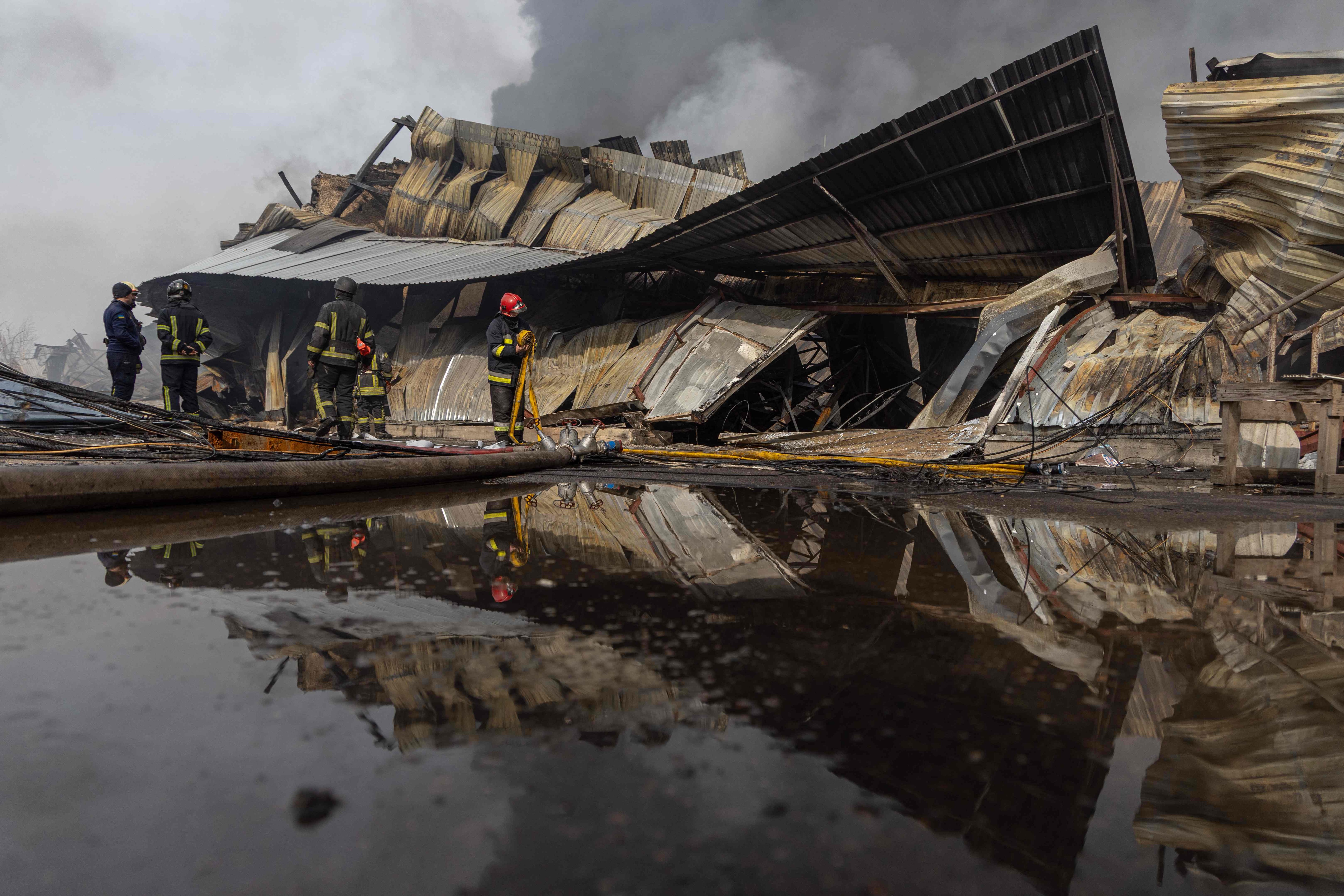 Ukrainian firefighters work to extinguish a fire following a strike on the outskirts of Odessa on March 11, 2025 (AFP photo)