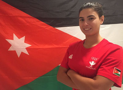 Jordan swimmer Talita Baqlah poses with the Jordanian flag at the Olympic Village during the Olympic Games in Rio de Janeiro on Thursday (Photo courtesy of JOC News Service)
