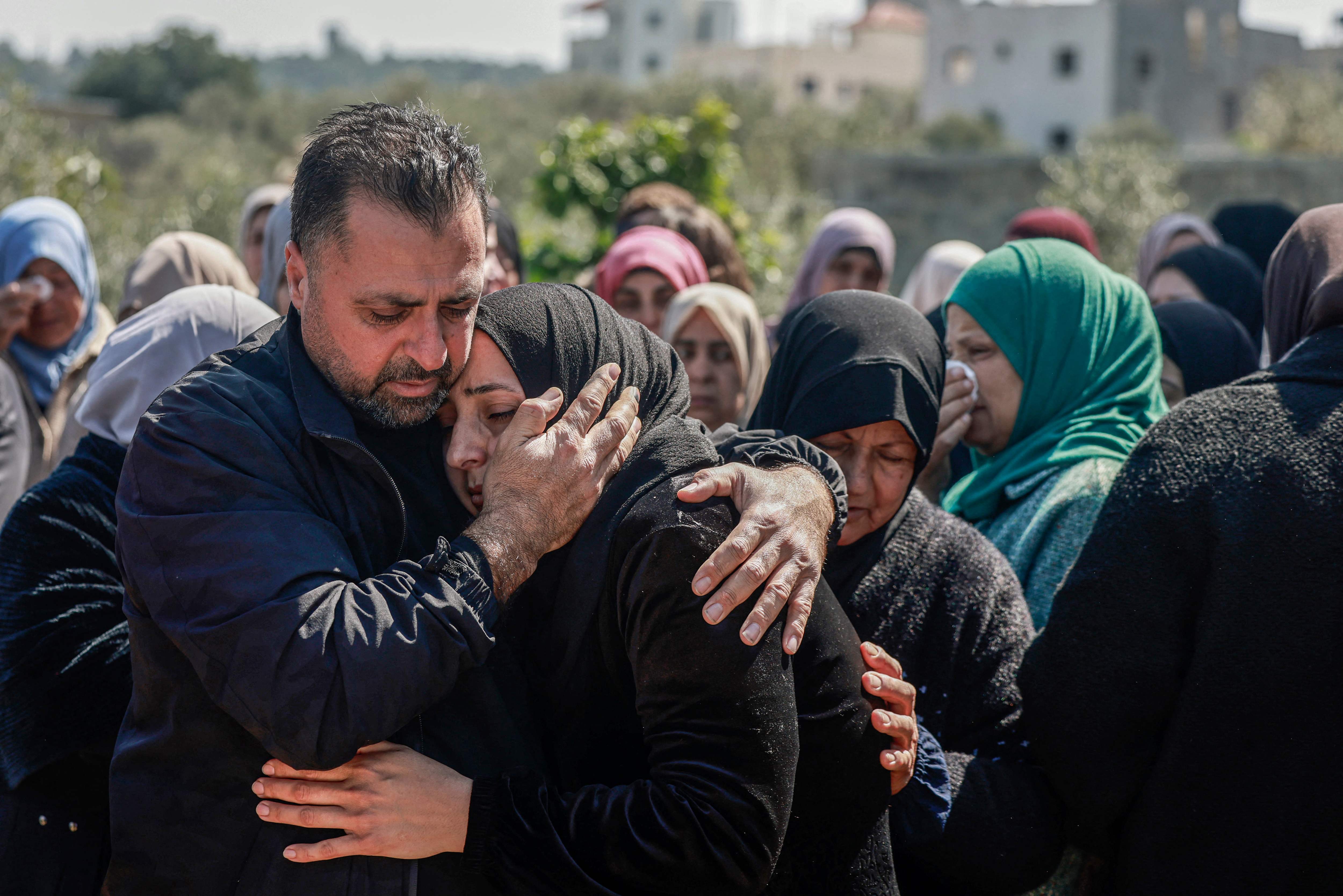 Palestinians mourn during the funeral of Ahmad Salah, who was killed after being hit by an Israeli military vehicle during a raid in Jenin city a day earlier, in his nearby hometown of Kafr Dan in the Israeli-occupied West Bank on March 11, 2025 (AFP photo)