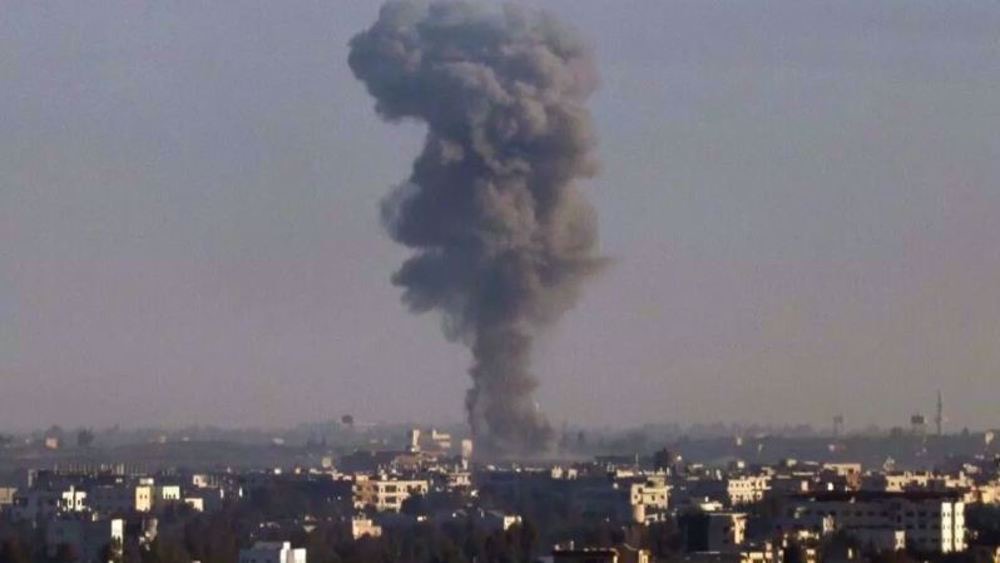 Taken from the Israeli-occupied Golan Heights, the picture shows smoke billowing above the Syrian province of Quneitra during an Israeli airstrike, on December 9, 2024 (AFP file photo)