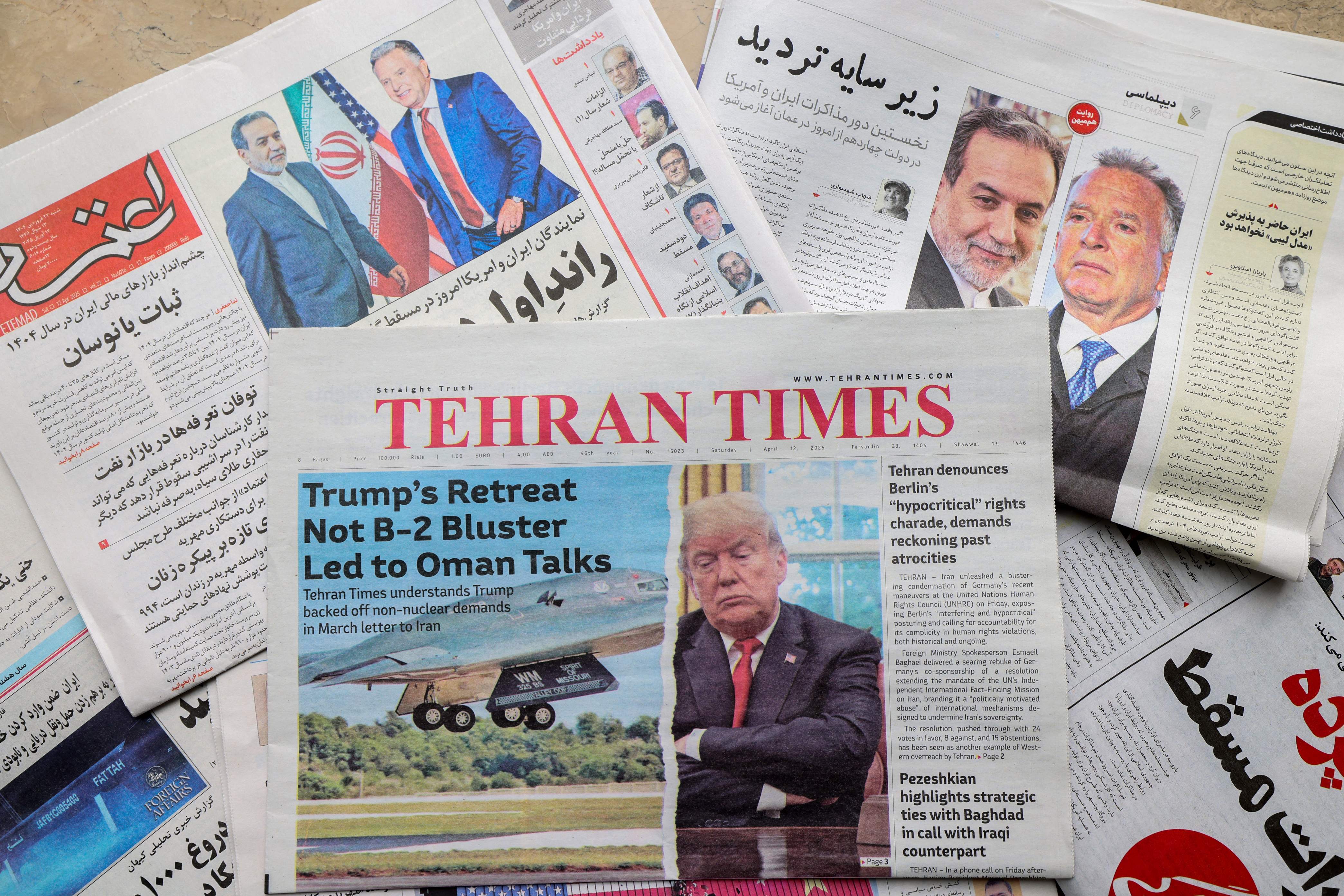 A picture shows newspaper frontpage headlines at a kiosk in Tehran on April 12, 2025, featuring the Iran-US talks on the Iranian nuclear programme set to begin in Oman on the same day (AFP photo)