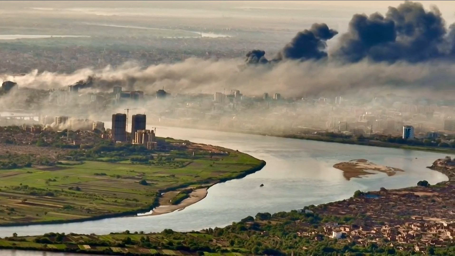 This video grab taken from AFPTV video footage on April 19, 2023, shows an aerial view of black smoke covering the sky above the capital Khartoum (AFP photo)