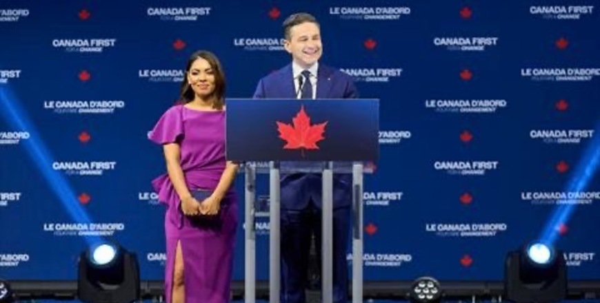 Canada's Conservative leader Pierre Poilievre (R) speaks alongside his wife Anaida at the Conservative election party at the Rogers Centre in Ottawa, Ontario on April 28, 2025 (AFP photo)