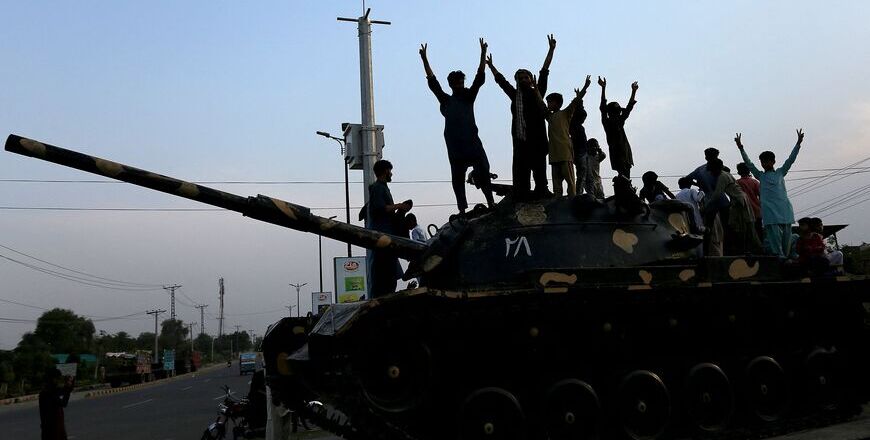 Pakistani people flash victory signs as they celebrate after the ceasefire between Pakistan and India, in Multan on May 10, 2025 (AFP photo)