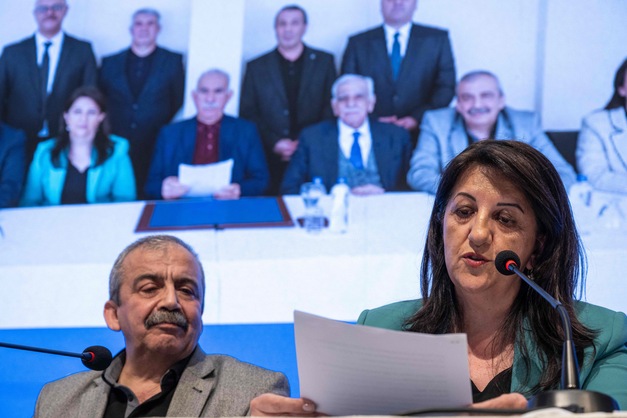 Pervin Buldan (R), MP of Equality and Democracy (DEM) Party reads a statement from jailed Kurdish leader Abdullah Ocalan's call during the press conference hold by DEM Party officials in Istanbul, on February 27, 2025  AFP photo)