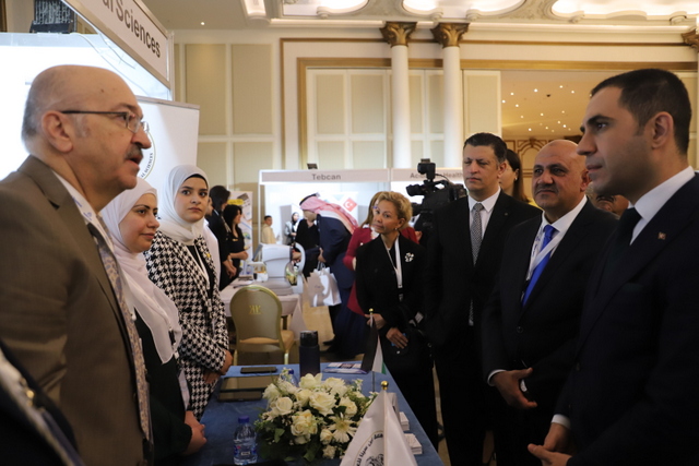From right to left, Commercial Attache’ at the Turkish Embassy in Amman Mehmet Oral, WACML CEO and Founder Nasser Abu Rumman and Deputy Director General of Jordan Tourism Board Wael Roussan listen to a representative of a company taking part in the Medical Tourism Expo held by WACML in Amman on Thursday (Photo courtesy WACML)