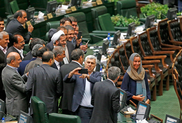 Iranian Deputies take selfies with High Representative of the European Union for Foreign Affairs and Security Policy and Vice President of the European Commission Federica Mogherini (right) after President of Iran Hassan Rouhani’s swearing in ceremony for his second term of presidency at the Iranian parliament in Tehran, Iran, on Saturday (Anadolu Agency photo)