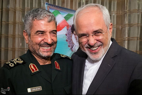 Islamic Revolutionary Guard Corps (IRGC) Commander Mohammad Ali Jafari (left) and Iran’s Foreign Minister Mohammad Javad Zarif smile during a coordination meeting for the 40th anniversary of the Islamic Revolution, in Tehran, Iran, on Monday (Reuters photo)
