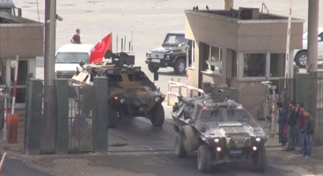 Military convoy leaves the border compound at the Habur border gate between Turkey and Iraq in this still image taken from video on Tuesday (Reuters photo)