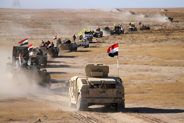 Armoured personnel carriers and humvees of the Iraqi forces, supported by members of the Hashed Al Shaabi, advance in the western desert in the northern Iraqi region of Al Hadar, 105km south of Mosul, on Thursday, as they attempt to flush out remaining Daesh group fighters in Al Jazeera region straddling Salaheddin, Nineveh and Anbar provinces (AFP photo)