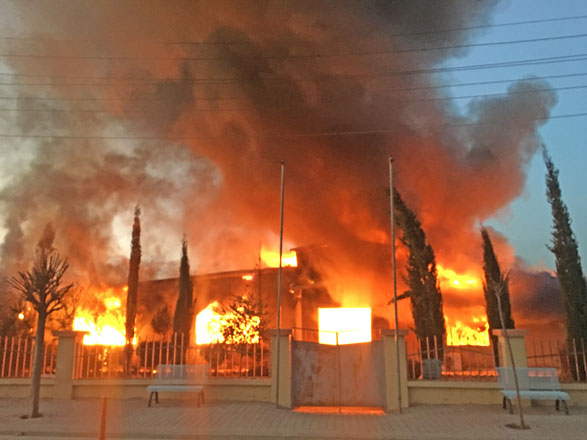 Smoke rises as demonstrators set a state building on fire 45 kilometres from the Kurdish-controlled city of Sulaymaniyah, within anti-government protests in Iraq on Monday (Anadolu Agency photo)