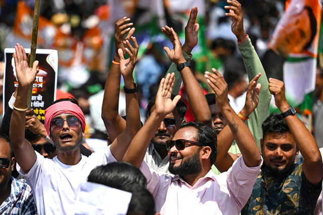 India’s Congress Party activists and supporters protest against conviction of Congress Party leader Rahul Gandhi in a criminal defamation case, in New Delhi, on Monday (AFP photo)