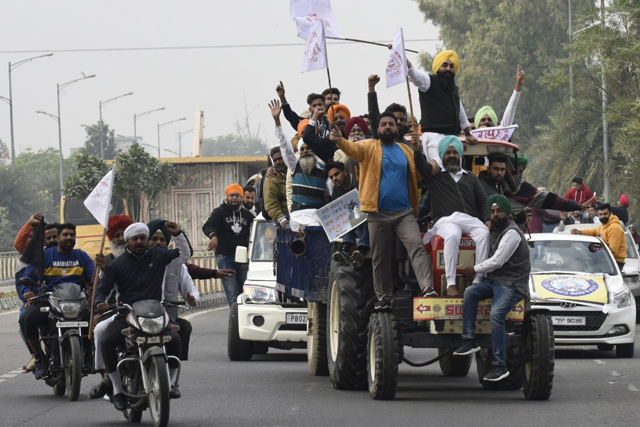 Activists of National Students’ Union of India (NSUI) shout slogans against India’s Prime Minister Narendra Modi during a protest in support of a nationwide general strike called by farmers to protest against the recent agricultural reforms in Amritsar on Tuesday  (AFP photo)
