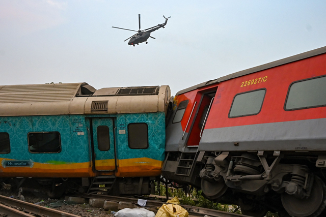 Rescue workers search for survivors at the accident site of a three-train collision near Balasore, about 200km from the state capital Bhubaneswar, on Saturday (AFP photo)