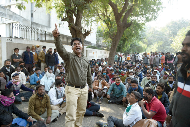 Workers from the Safai Kamdar Association demonstrate outside the Amadav Municipal Corporation office as they demand for higher wages and better working conditions, in Ahmedabad, on Saturday (AFP photo)